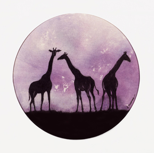 Three giraffes standing in front of a purple sky.